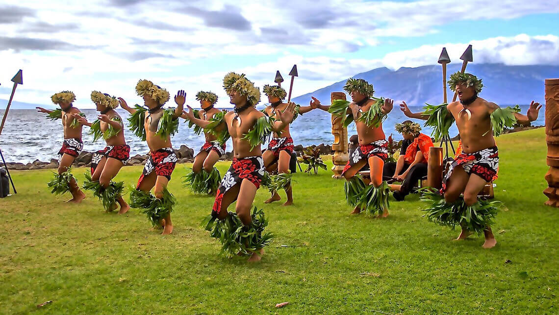 male hula dancers performing outdoors