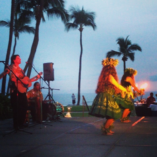 hula dancing in evening with guitar player