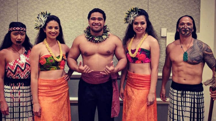 group of hula dancers in costumes