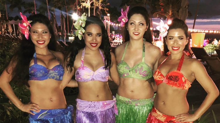 group of hula dancers in costumes