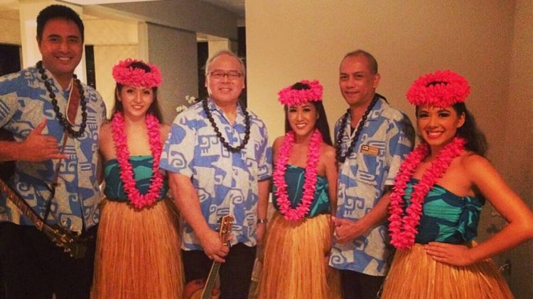 hawaiian fire dancer in front of hotel